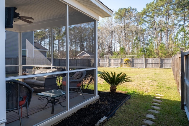 view of yard featuring a ceiling fan and a fenced backyard