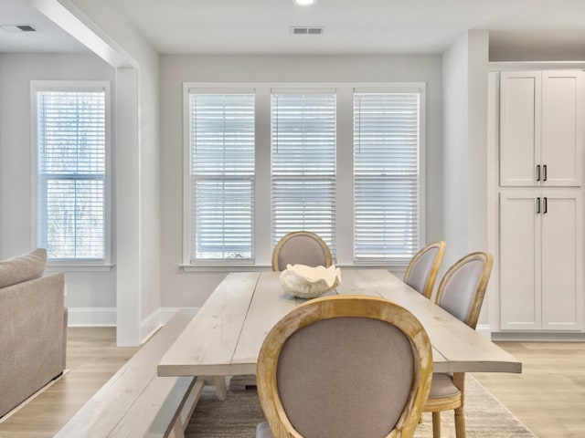 dining area featuring plenty of natural light and light wood-type flooring