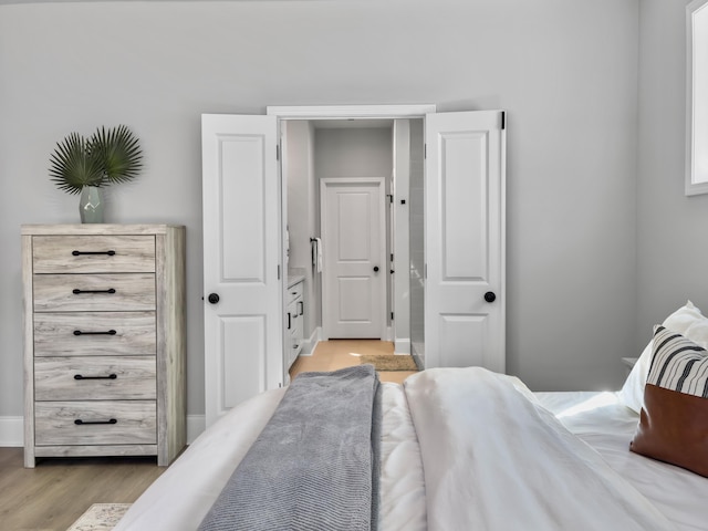 bedroom with light hardwood / wood-style floors