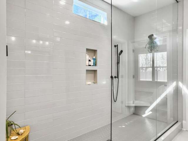 bathroom with tiled shower