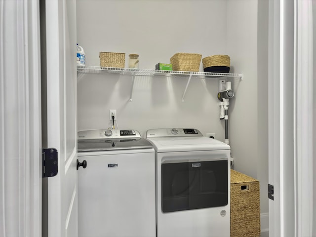 laundry area with independent washer and dryer