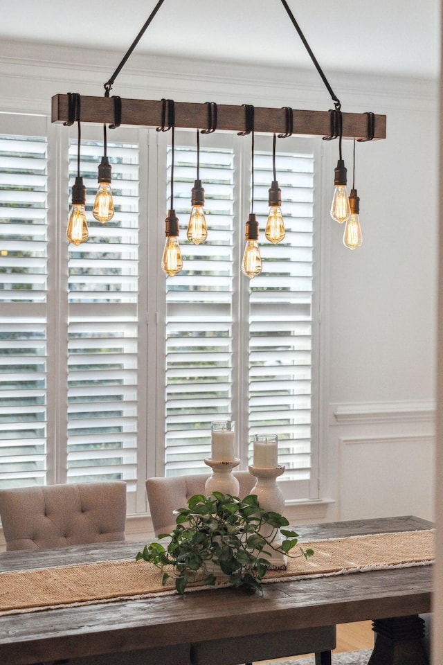 dining room featuring crown molding