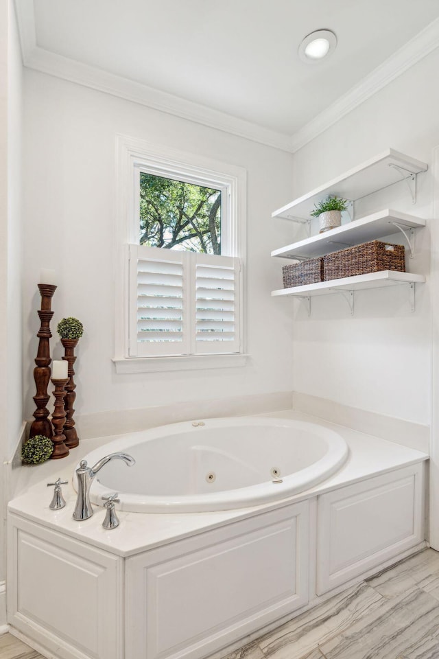 bathroom featuring a bath and crown molding