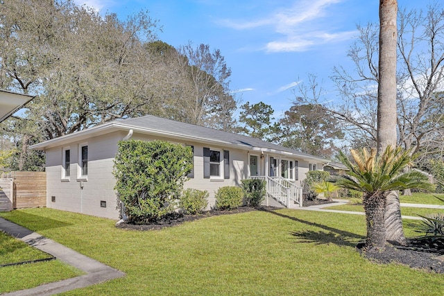 single story home with a front yard and fence