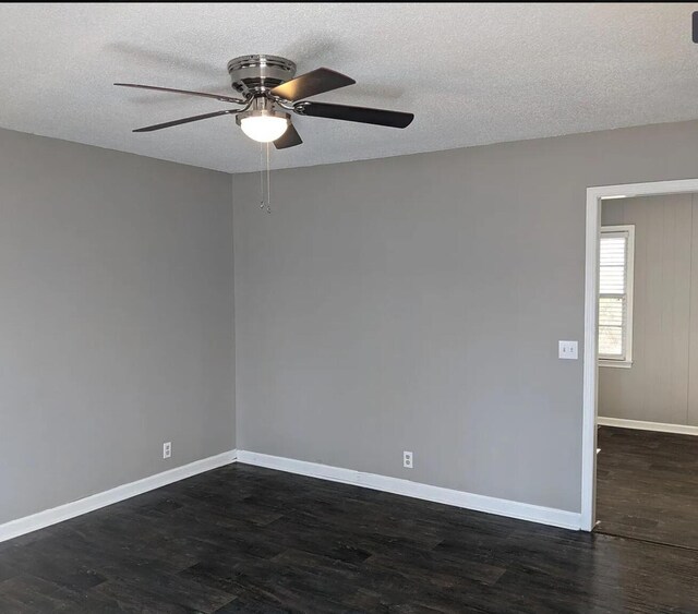 3567 Dewey Cox Rd, Lake City, SC 29560 - empty room with ceiling fan, dark wood finished floors, baseboards, and a textured ceiling