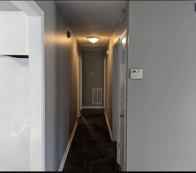3567 Dewey Cox Rd, Lake City, SC 29560 - hall featuring attic access, baseboards, and a textured ceiling