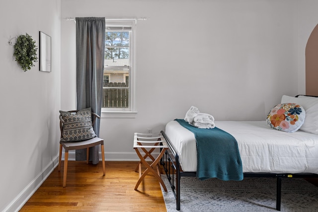 bedroom with wood-type flooring