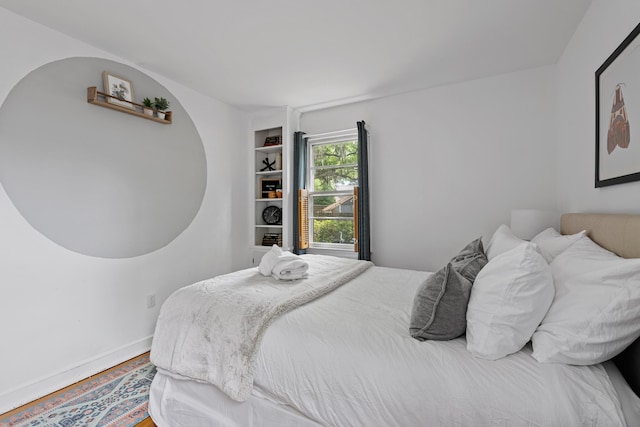 bedroom with hardwood / wood-style floors