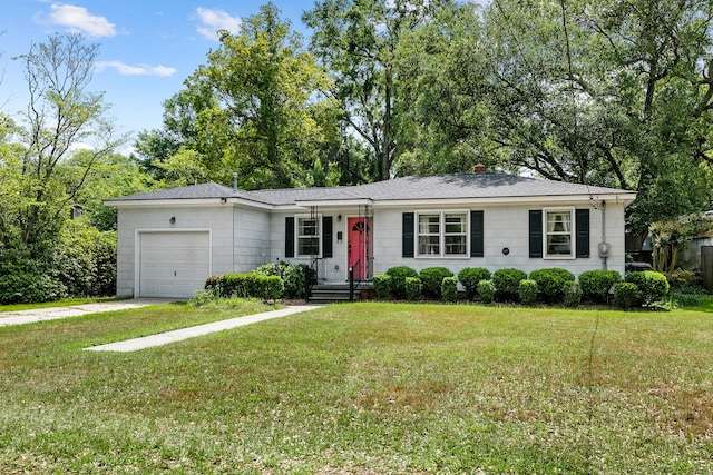 single story home with a garage and a front lawn