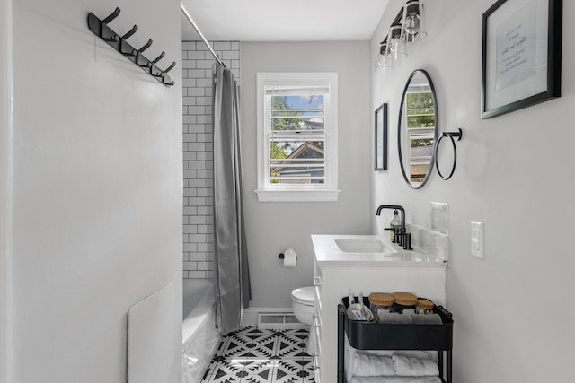 full bathroom with shower / bathtub combination with curtain, vanity, and toilet