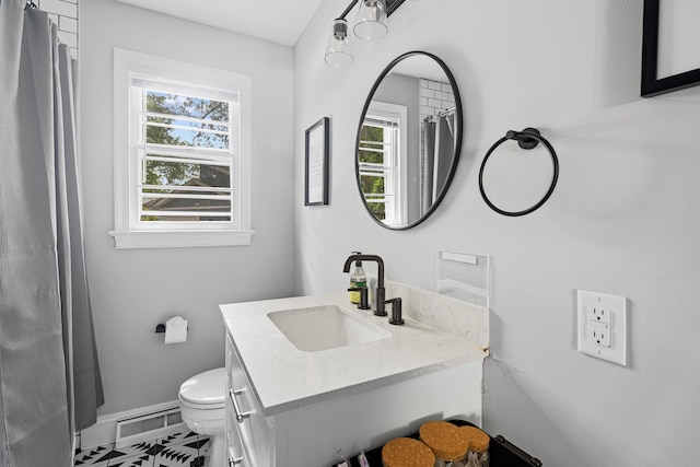 bathroom featuring vanity and toilet