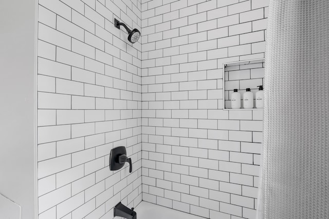 bathroom with shower / bath combination with curtain