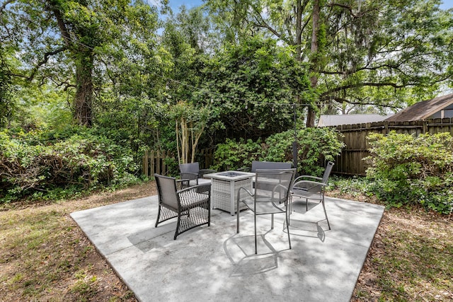 view of patio / terrace featuring a fire pit