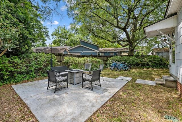 view of patio / terrace with an outdoor fire pit