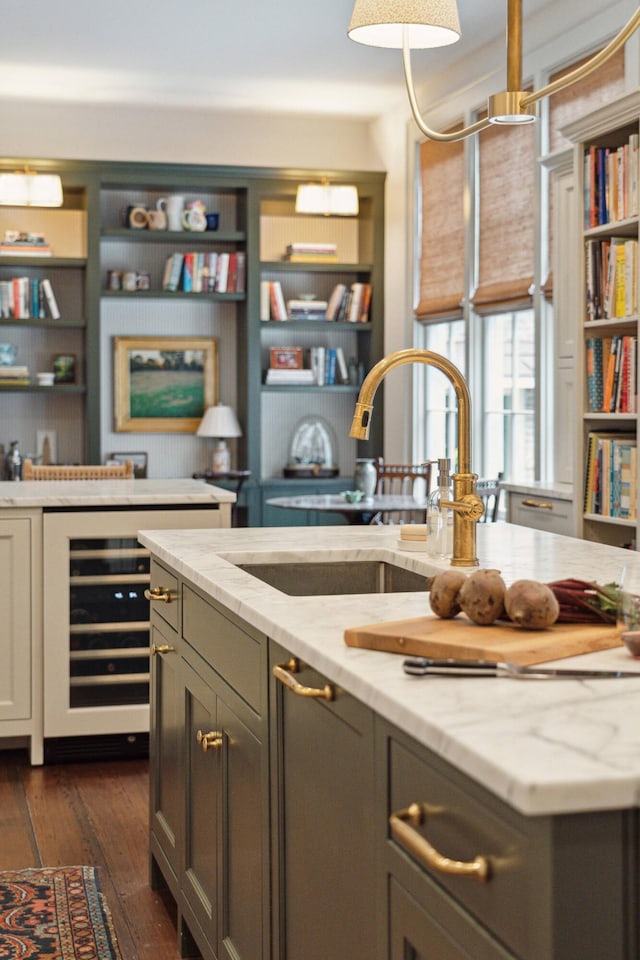 bar featuring gray cabinetry, dark wood-type flooring, wine cooler, light stone countertops, and sink