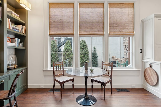 dining area with dark wood-type flooring