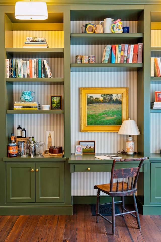 living area with dark hardwood / wood-style flooring and built in shelves