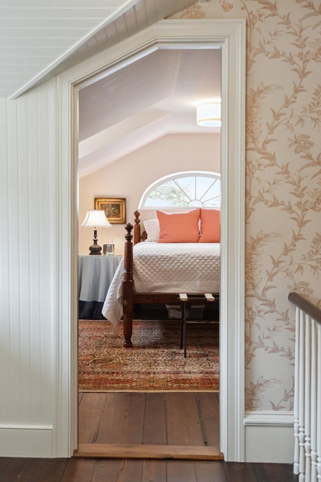 bedroom featuring lofted ceiling and wood-type flooring