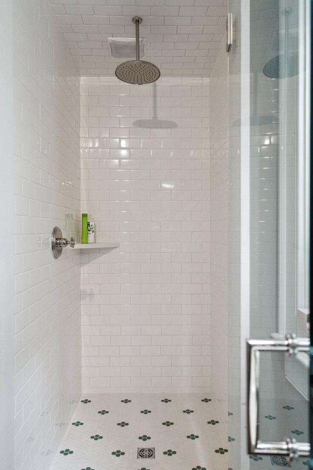 bathroom with a tile shower