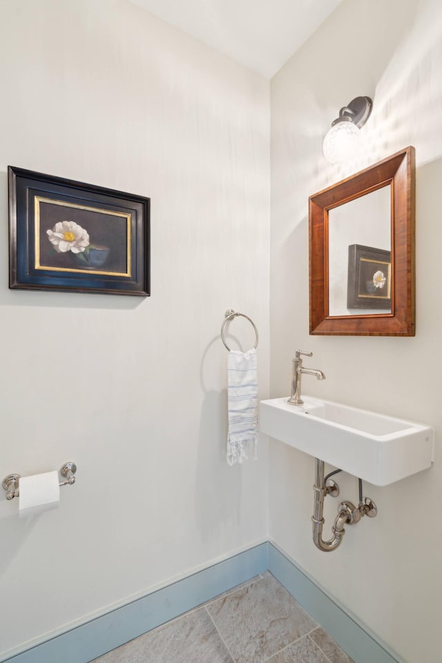 bathroom with tile patterned floors