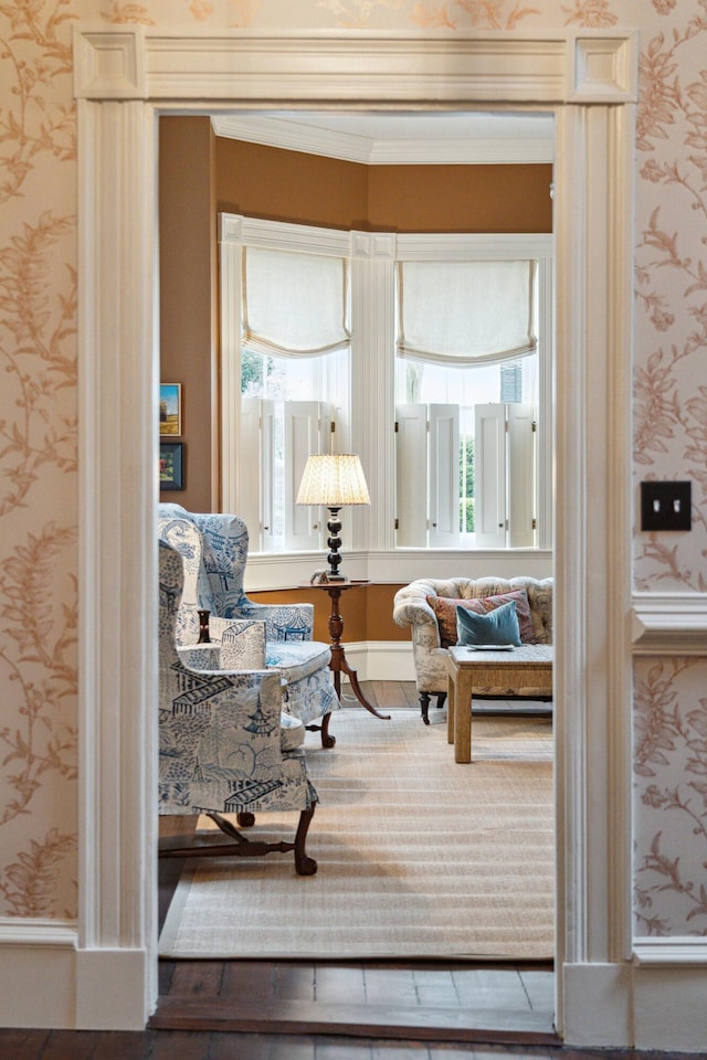 sitting room featuring ornamental molding