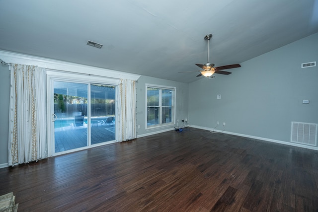 unfurnished living room featuring ceiling fan, lofted ceiling, and dark wood-type flooring