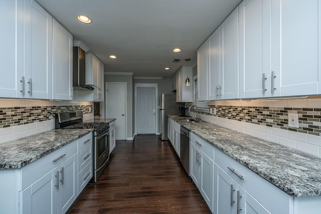 kitchen with white cabinets, stainless steel appliances, and dark wood-type flooring