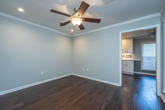 empty room with ceiling fan, ornamental molding, and dark wood-type flooring