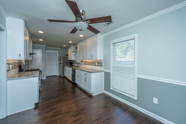 kitchen featuring light stone countertops, dark hardwood / wood-style flooring, ceiling fan, and white cabinets