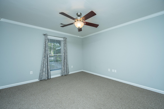 empty room featuring ceiling fan, crown molding, and carpet