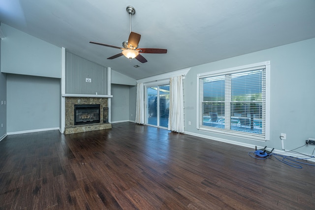 unfurnished living room featuring vaulted ceiling, ceiling fan, and dark wood-type flooring