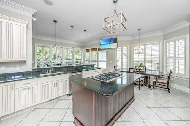 kitchen with a center island, stainless steel appliances, sink, and plenty of natural light