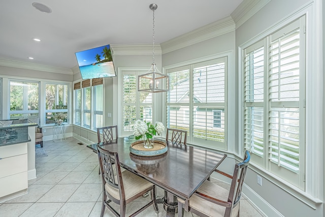 tiled dining room featuring ornamental molding