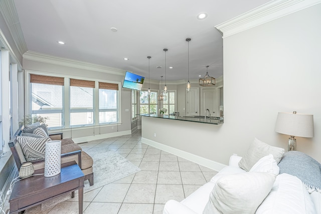 living room with crown molding, light tile patterned flooring, and sink