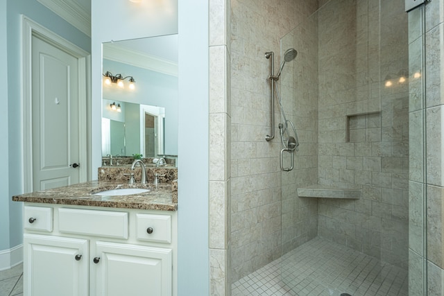 bathroom with vanity, ornamental molding, and an enclosed shower