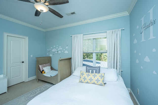 carpeted bedroom with ceiling fan and crown molding