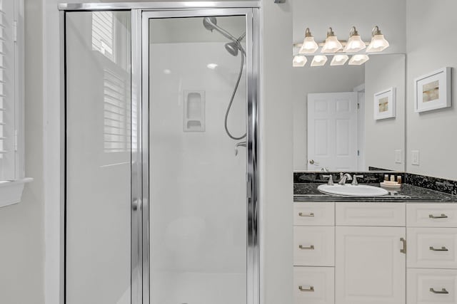 full bathroom featuring vanity and a shower stall