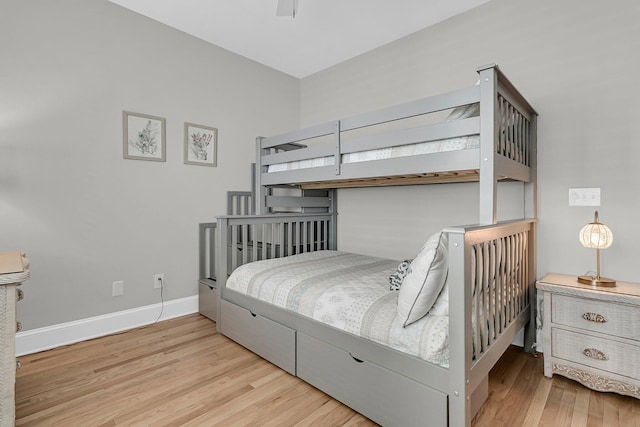 bedroom with baseboards and light wood-style floors