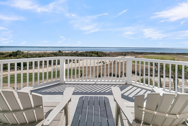 wooden terrace with a water view