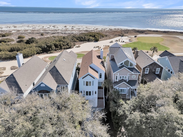 aerial view featuring a residential view, a water view, and a beach view