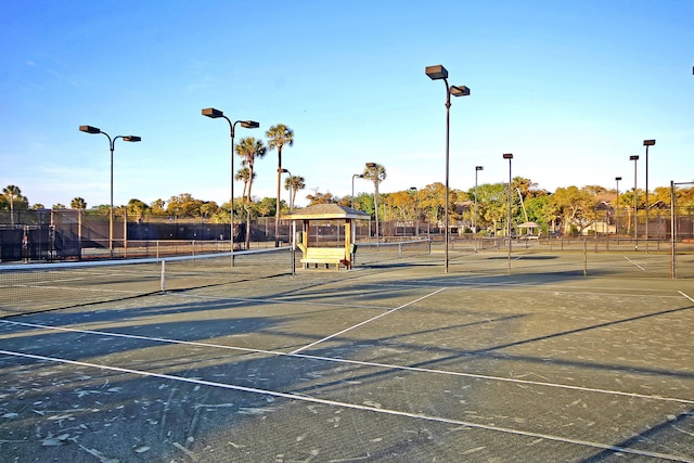 view of sport court featuring fence