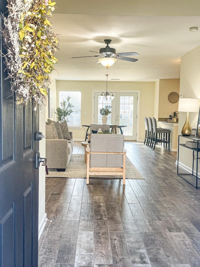 entryway with ceiling fan and dark wood-type flooring