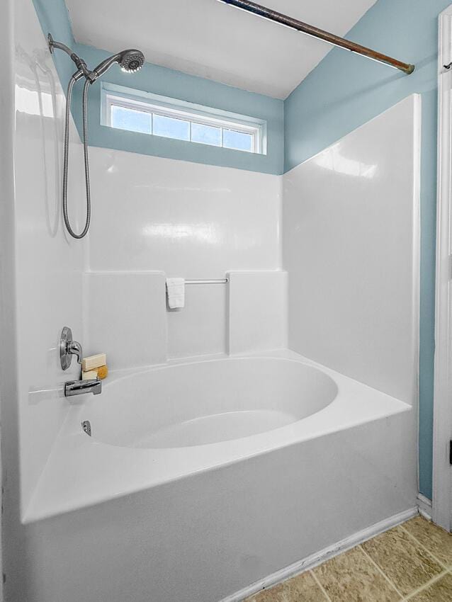 bathroom with shower / bathtub combination