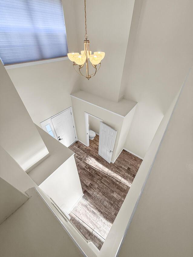 entryway featuring a chandelier and hardwood / wood-style flooring