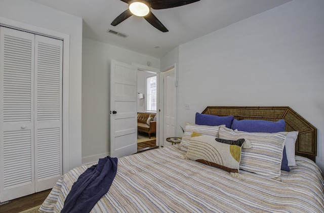 bedroom with a closet, ceiling fan, and hardwood / wood-style flooring