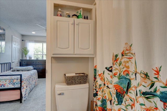 carpeted bedroom with a textured ceiling