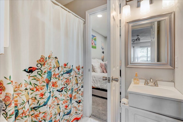 bathroom featuring vanity and ceiling fan