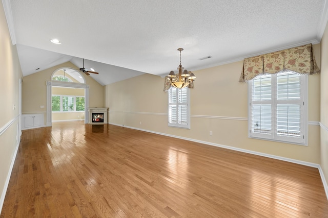 9175 Spring Branch Ct, North Charleston, SC 29406 - unfurnished living room featuring a lit fireplace, light wood finished floors, a chandelier, ceiling fan, and a textured ceiling