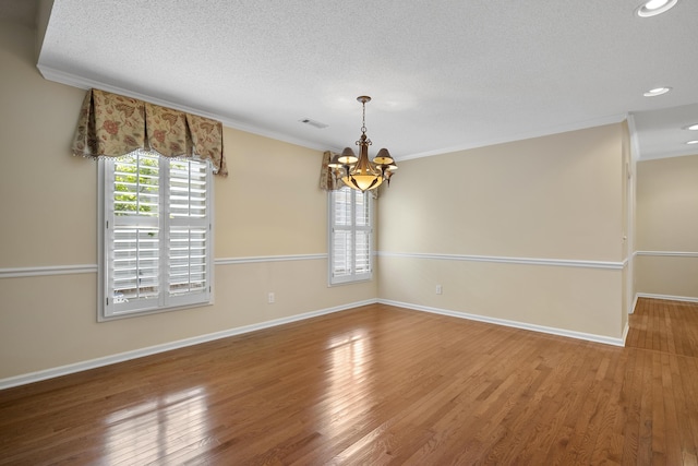 9175 Spring Branch Ct, North Charleston, SC 29406 - empty room featuring a chandelier, ornamental molding, a textured ceiling, wood finished floors, and recessed lighting