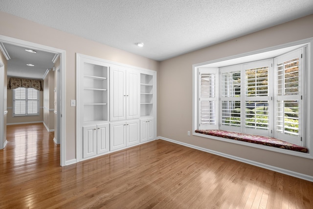 9175 Spring Branch Ct, North Charleston, SC 29406 - unfurnished room with wood finished floors, a textured ceiling, and recessed lighting
